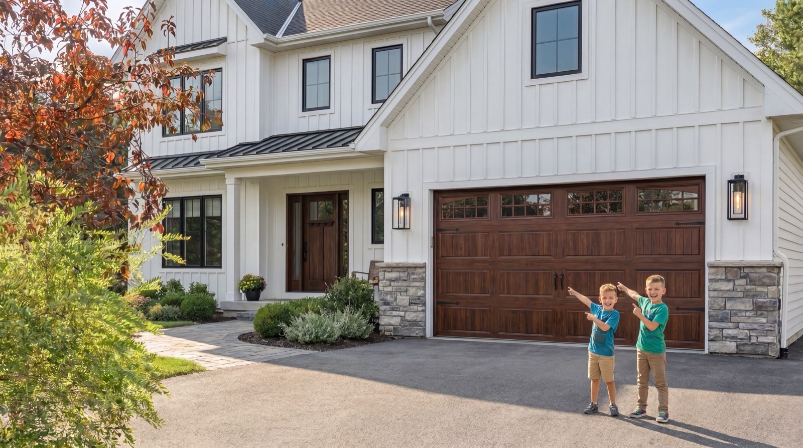 A modern white farmhouse with a rich wood-finish double garage door on a sunny driveway, two kids pointing up at the new door